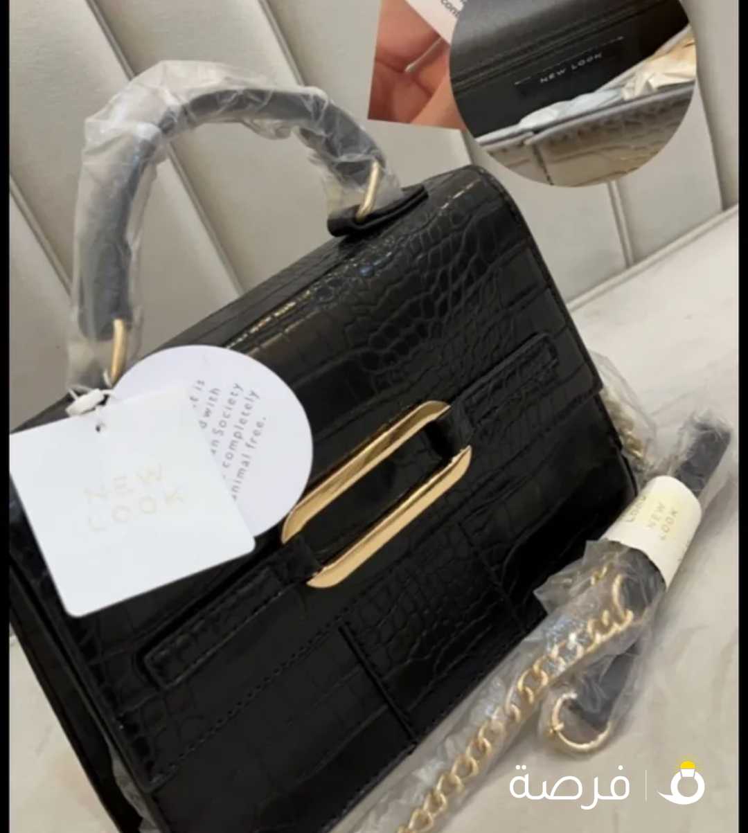 شنطة وارد لندن ماركة ديفيد جونز ، اللون وردي يميل للبيج ، الحجم وسط مع كامل ملحقاتها + كارت البراند،