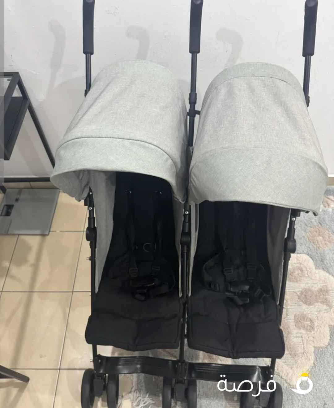 عربة أطفال توأم