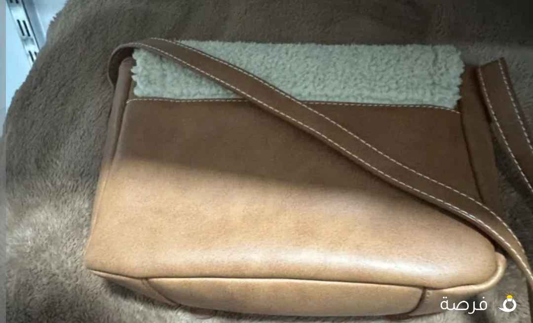 شنطة Ugg استراليا جلد و صوف لون بني وبيج استعمال بسيط جدا